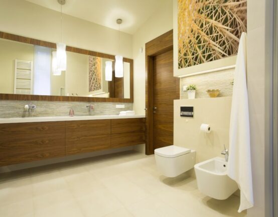 Spacious washroom with wooden furniture in modern interior